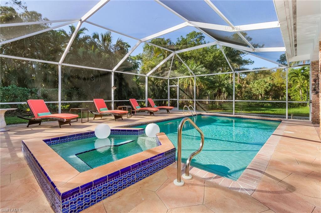 2950 Coach House Lane Naples, FL 34105 - Photo 28 of 50 a view of a park with swings and slides