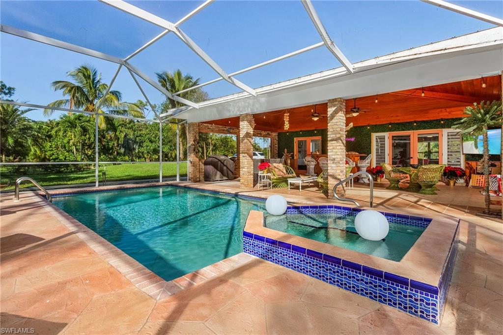 2950 Coach House Lane Naples, FL 34105 - Photo 29 of 50 a view of a backyard with sitting area