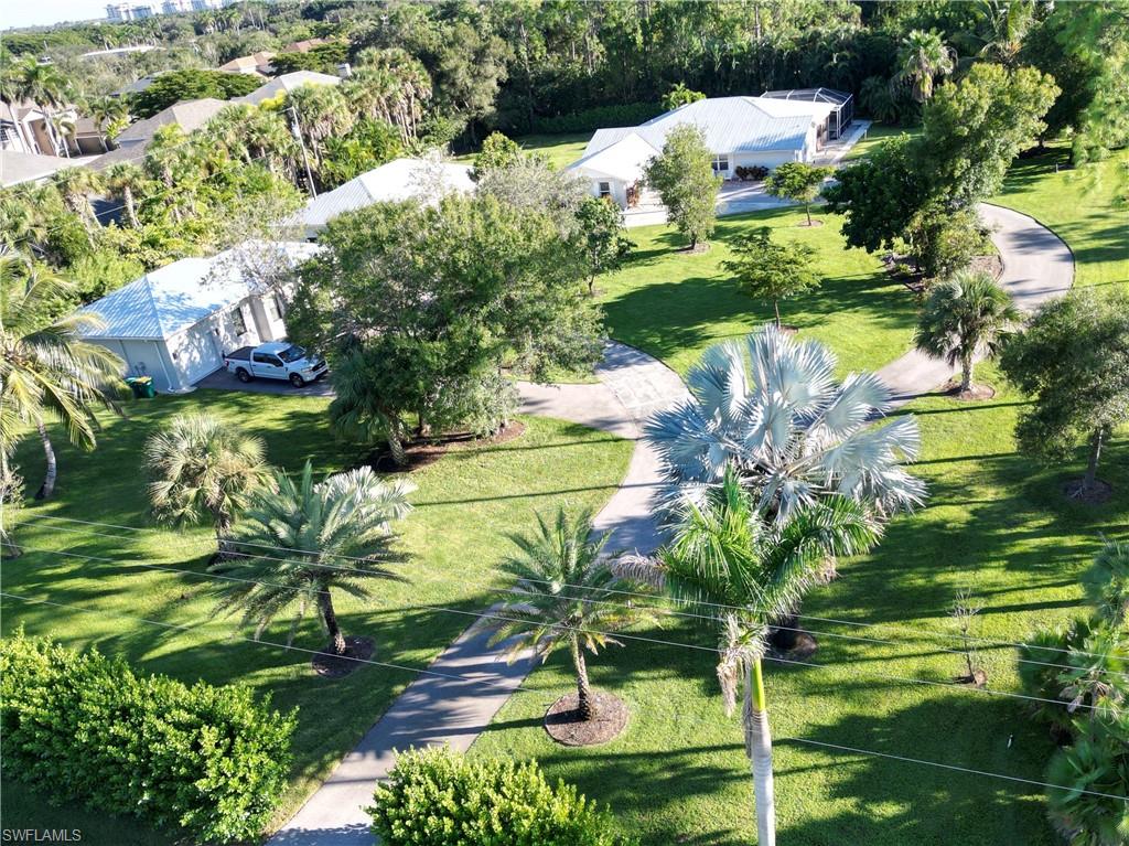 2950 Coach House Lane Naples, FL 34105 - Photo 41 of 50 a view of a garden