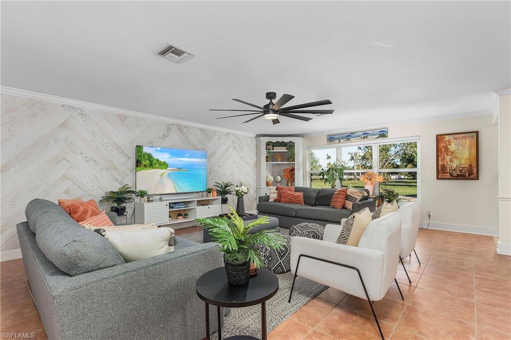 2950 Coach House Lane Naples, FL 34105 - Photo 10 of 50 a living room with furniture and a large window