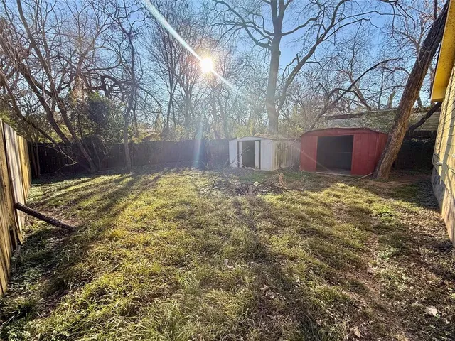 a view of a backyard of the house