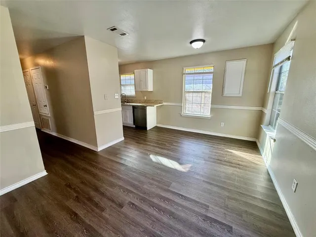 a view of a kitchen from a hallway