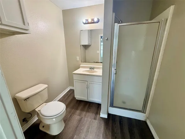 a white toilet sitting next to a bathroom sink
