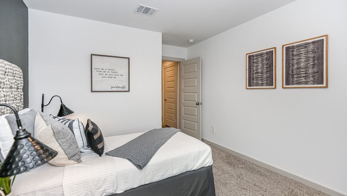 7918 Murciana Drive Rosharon, TX 77583 - Photo 4 of 21 a bedroom with a bed and the wall painting