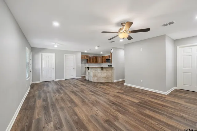 a view of a kitchen with a dishwasher kitchen stove and cabinets