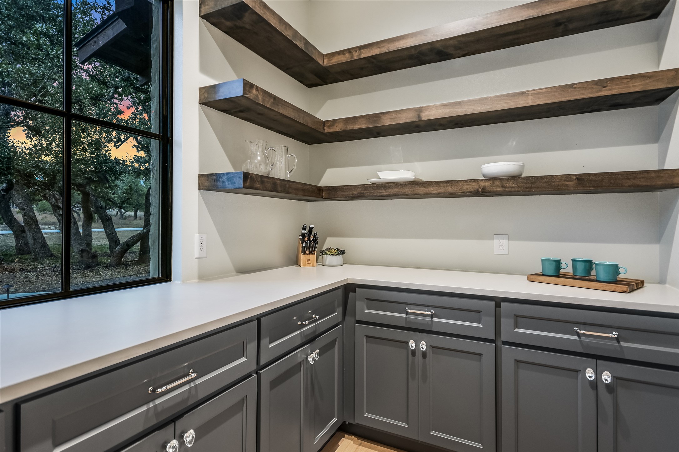 207 Gwendolyns Trail Wimberley, TX 78676 - Photo 13 of 40 a kitchen with a sink and cabinets