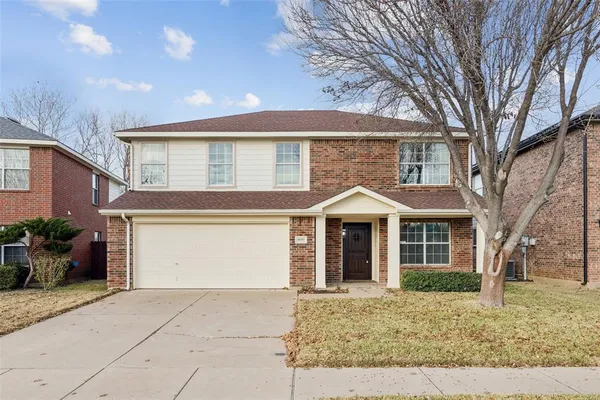 a front view of a house with yard