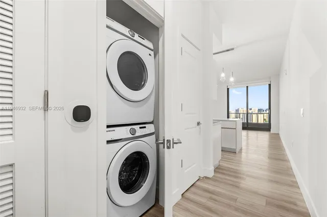 a view of a hallway with washer and dryer