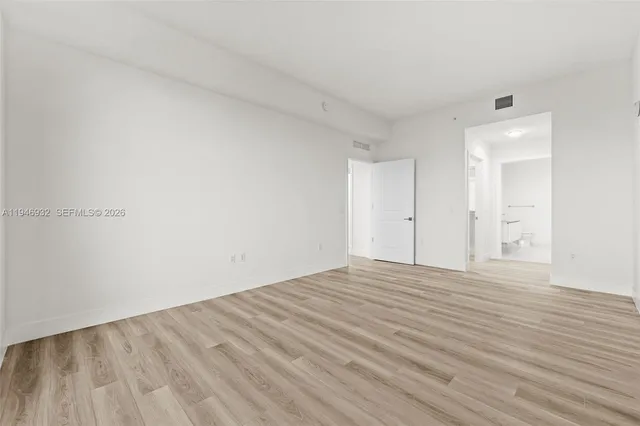 a spacious bathroom with a double vanity and a shower
