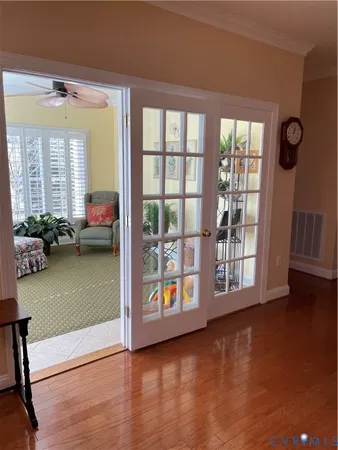 a view of a living room and hardwood floor