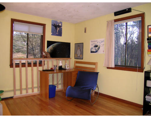122 South Acton Road Stow, MA 01775 - Photo 11 of 21 a living room with furniture and a flat screen tv