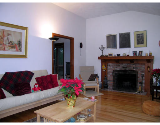 122 South Acton Road Stow, MA 01775 - Photo 2 of 21 a living room with furniture and a fireplace