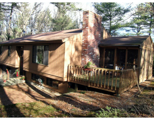 122 South Acton Road Stow, MA 01775 - Photo 21 of 21 a view of house with a small yard