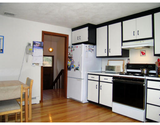 122 South Acton Road Stow, MA 01775 - Photo 6 of 21 a kitchen with stainless steel appliances a refrigerator sink and cabinets