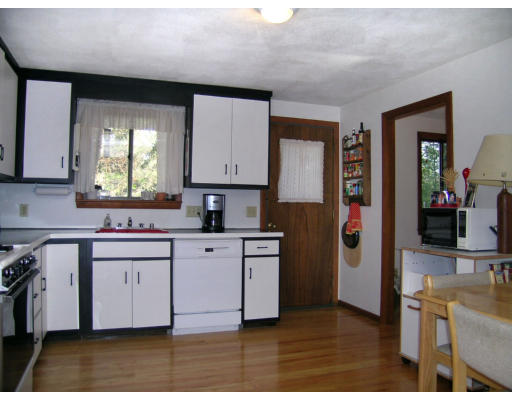 122 South Acton Road Stow, MA 01775 - Photo 7 of 21 a kitchen with stainless steel appliances granite countertop a sink stove and refrigerator