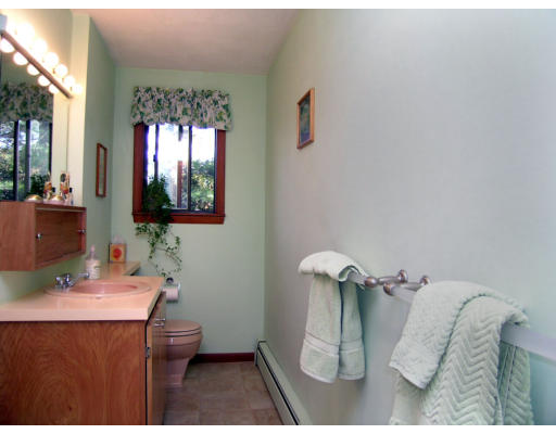 122 South Acton Road Stow, MA 01775 - Photo 8 of 21 a bathroom with a sink and a mirror