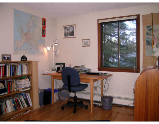 122 South Acton Road Stow, MA 01775 - Photo 10 of 21 a workspace with furniture bookshelf and a window