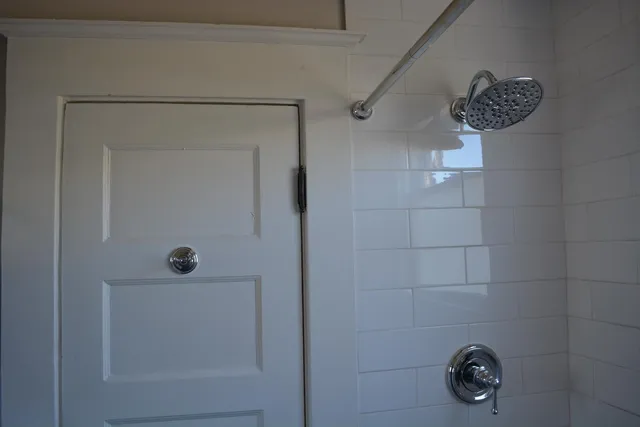 a view of a workspace room with a table and chair