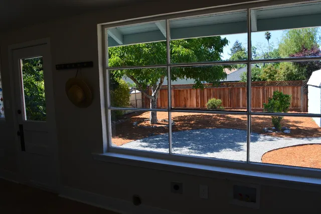 a kitchen with stainless steel appliances granite countertop a stove and a refrigerator