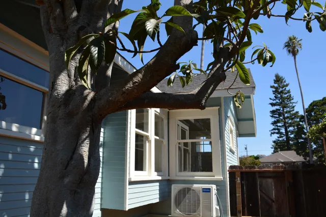 a bedroom with a bed and chair
