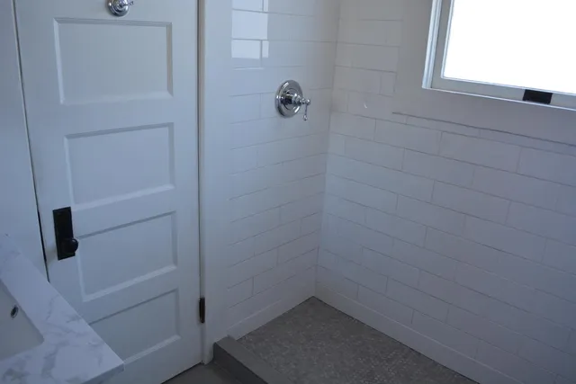 a backyard of a house with outdoor seating