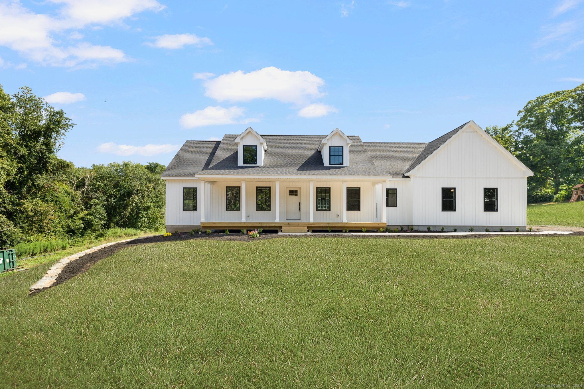 61 Beecher Road Brooklyn, CT 06234 - Photo 1 of 1 a front view of a house with a garden
