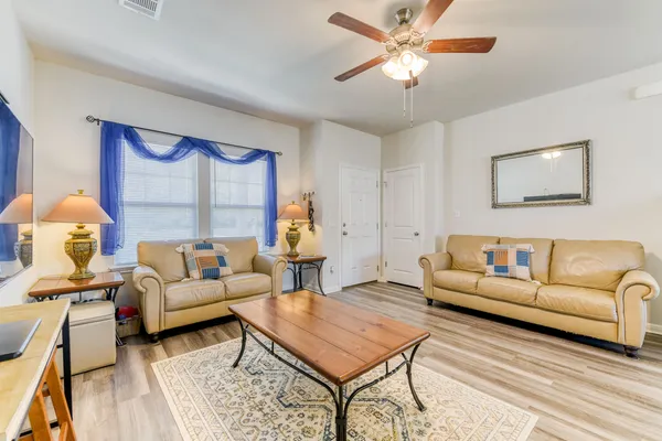 a living room with furniture and a window