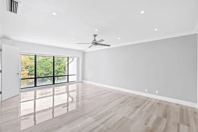 a bed room with a bed and a large window