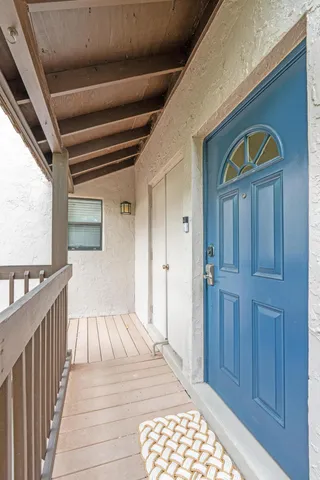 a view of a balcony with wooden floor