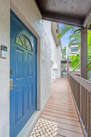 a view of entryway of house with wooden floor