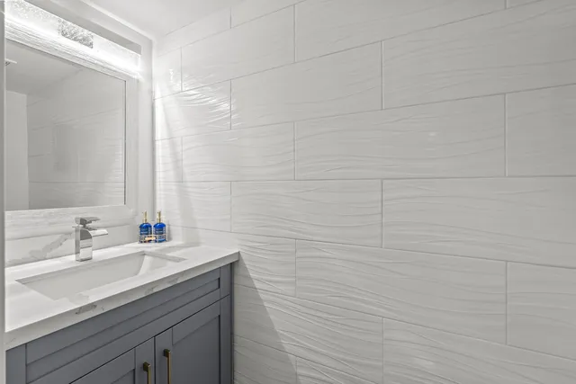 a bathroom with a sink and a mirror