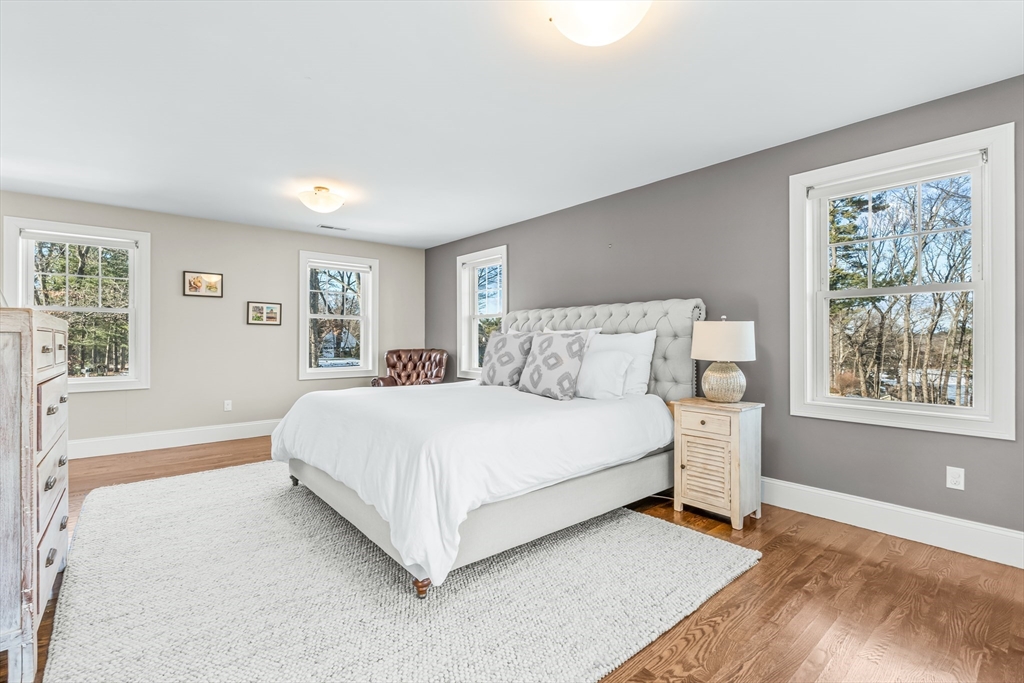 5 Rolling Lane Natick, MA 01760 - Photo 13 of 30 a bedroom with a bed lamp closet and window