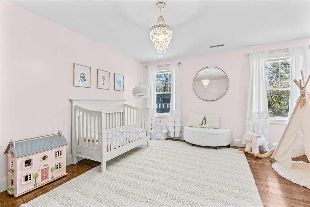 5 Rolling Lane Natick, MA 01760 - Photo 17 of 30 a bedroom with furniture and a large window