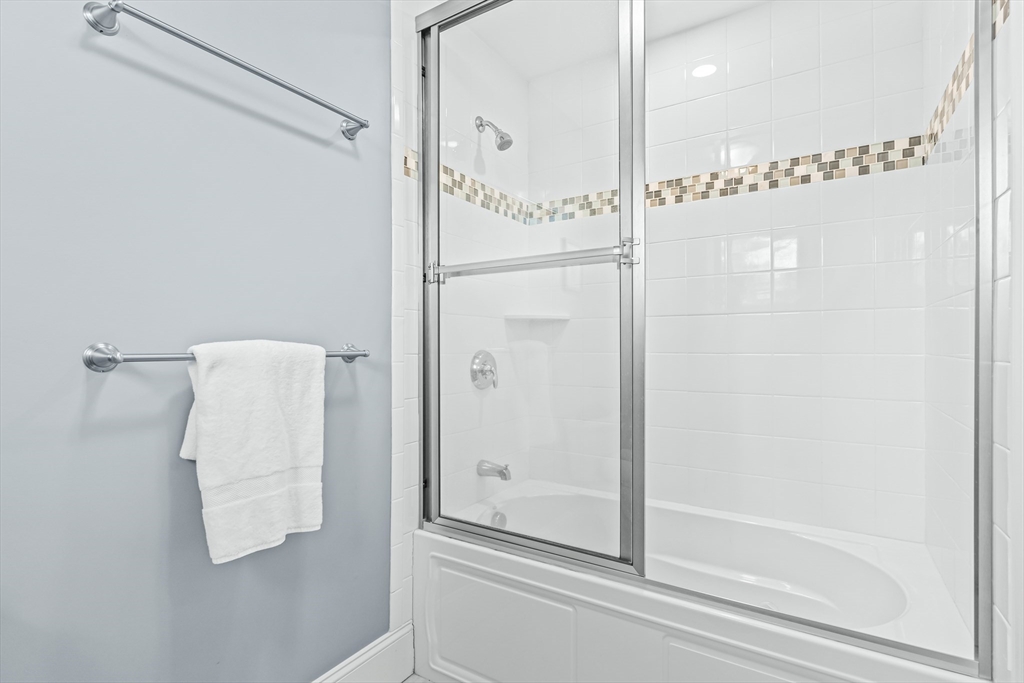 5 Rolling Lane Natick, MA 01760 - Photo 19 of 30 a bathroom with a shower and a mirror