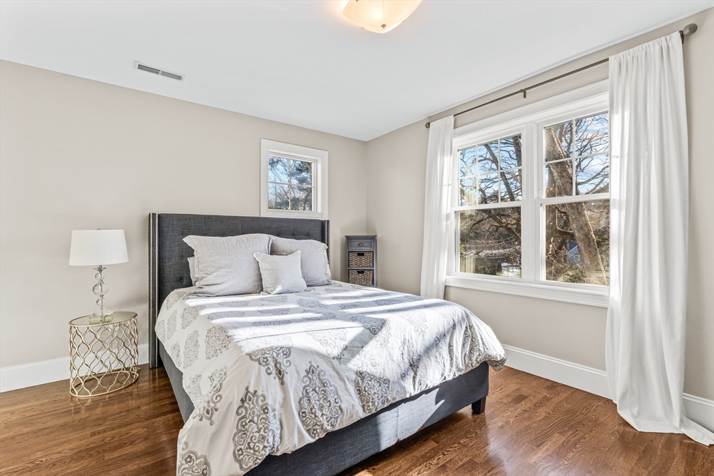 5 Rolling Lane Natick, MA 01760 - Photo 21 of 30 a bedroom with a bed and a window