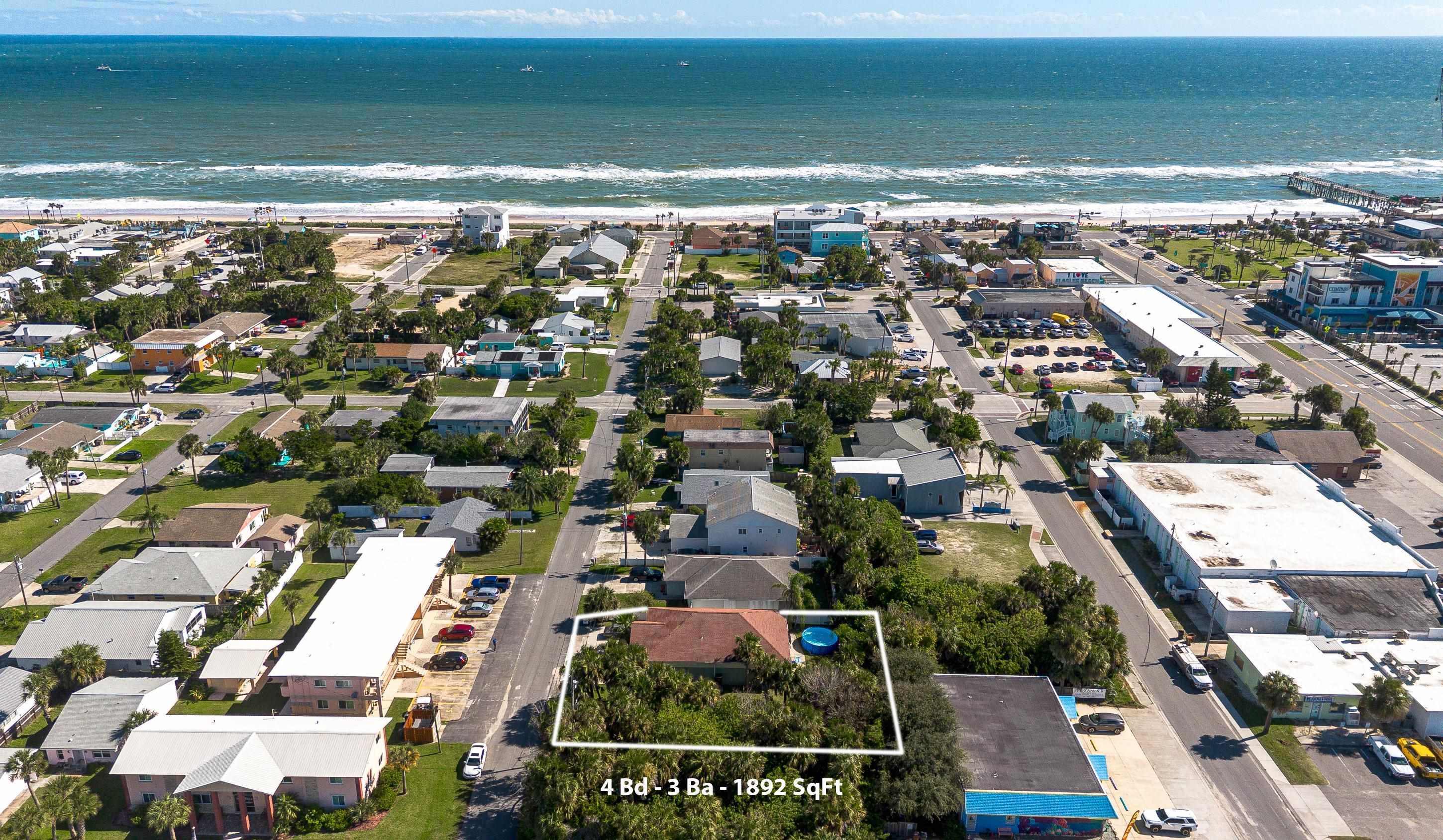 319 North 3rd Street Flagler Beach, FL 32136 - Photo 7 of 13 an aerial view of residential building with parking space