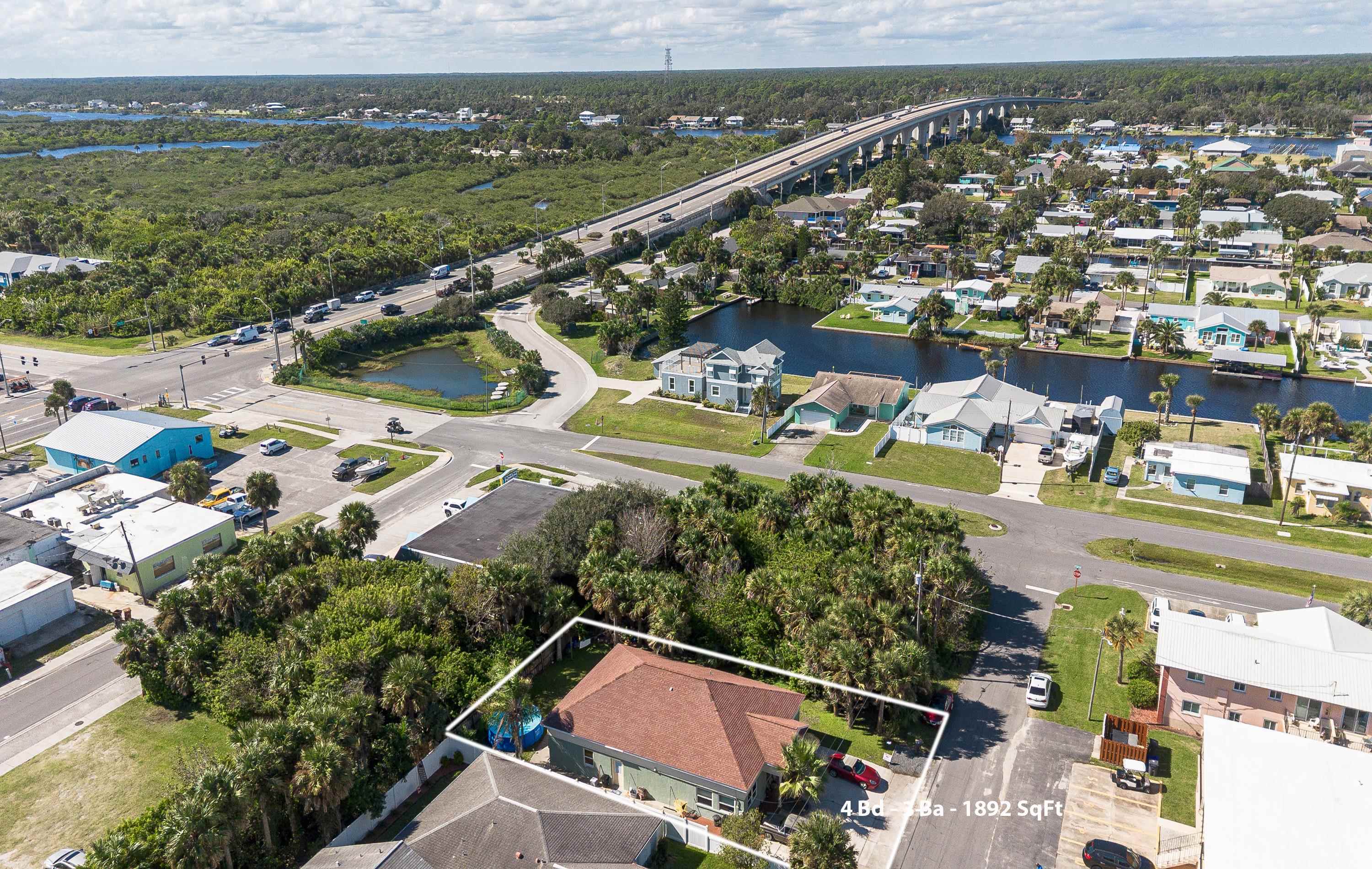 319 North 3rd Street Flagler Beach, FL 32136 - Photo 9 of 13 an aerial view of residential houses with outdoor space