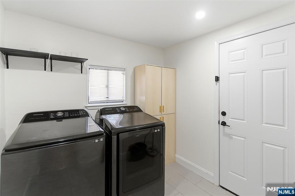 22 8th Avenue Newark, NJ 07104 - Photo 10 of 26 a utility room with dryer and washer