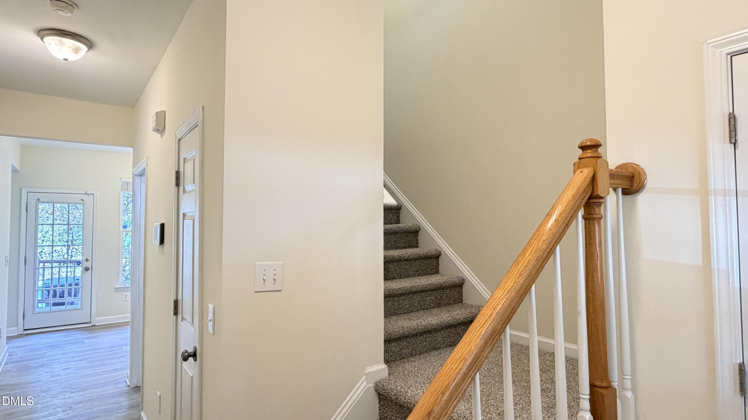 4123 Standing Rock Way Raleigh, NC 27604 - Photo 3 of 29 a view of staircase with wooden floor and staircase