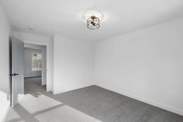 a view of a hallway to a bedroom