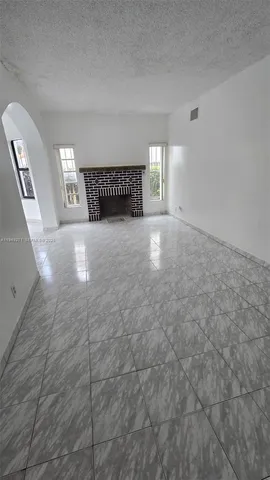 a view of empty room with windows