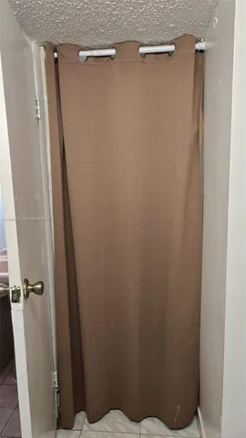 a bathroom with a shower and a sink