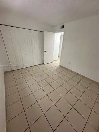 a bathroom with a toilet sink and shower