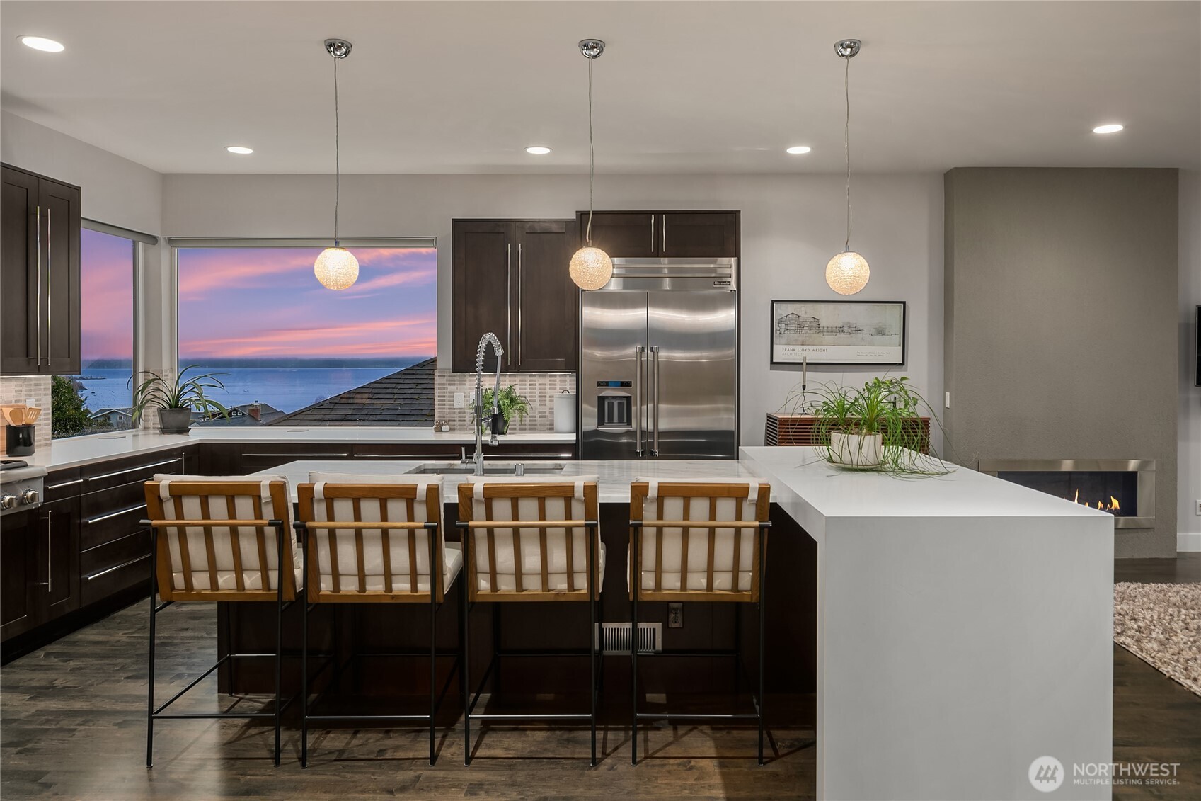 3501 Northwest 67th Street Seattle, WA 98117 - Photo 11 of 40 a kitchen with stainless steel appliances granite countertop a stove a sink and a refrigerator