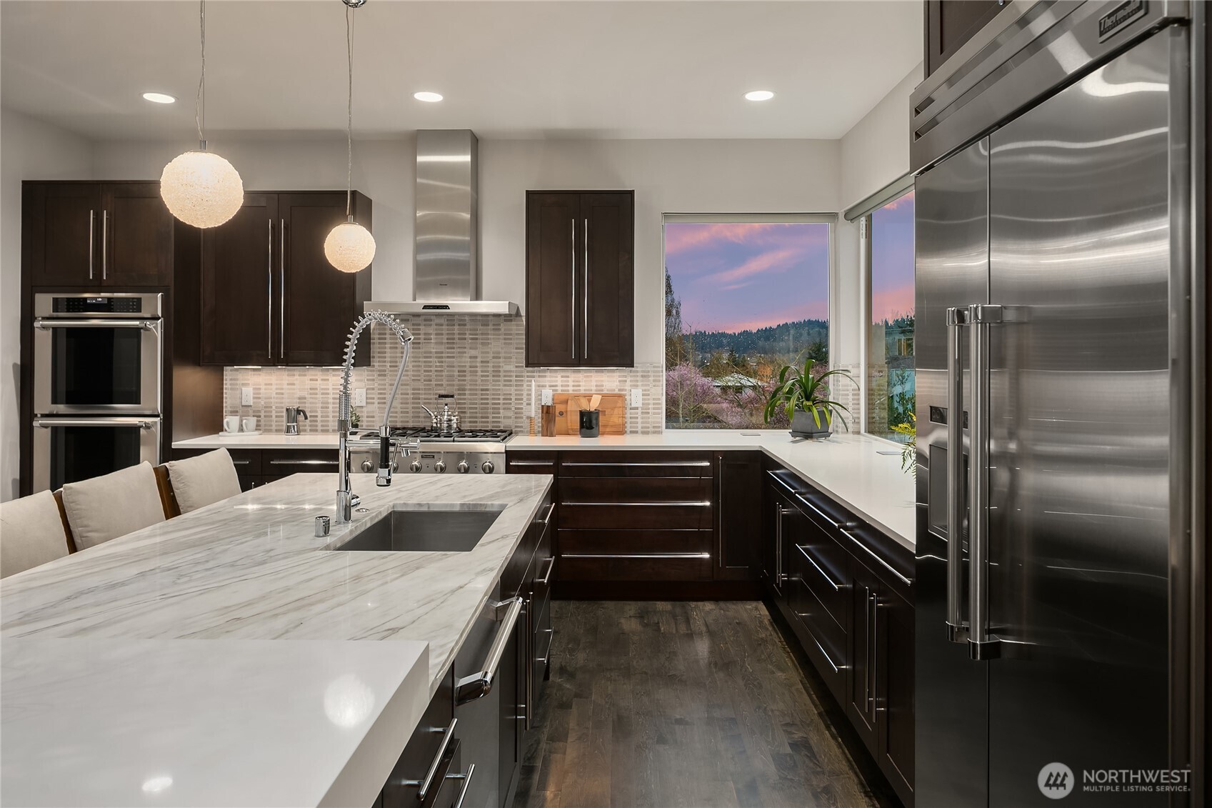 3501 Northwest 67th Street Seattle, WA 98117 - Photo 14 of 40 a large kitchen with a large counter top sink and stainless steel appliances