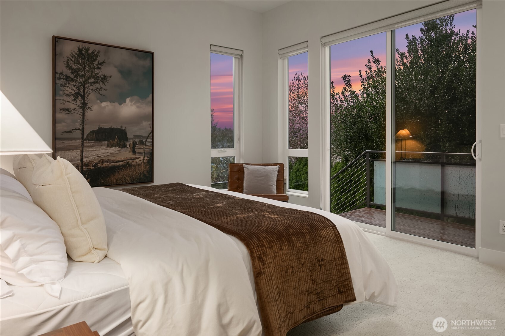 3501 Northwest 67th Street Seattle, WA 98117 - Photo 25 of 40 a bedroom with a large bed and a painting on the wall