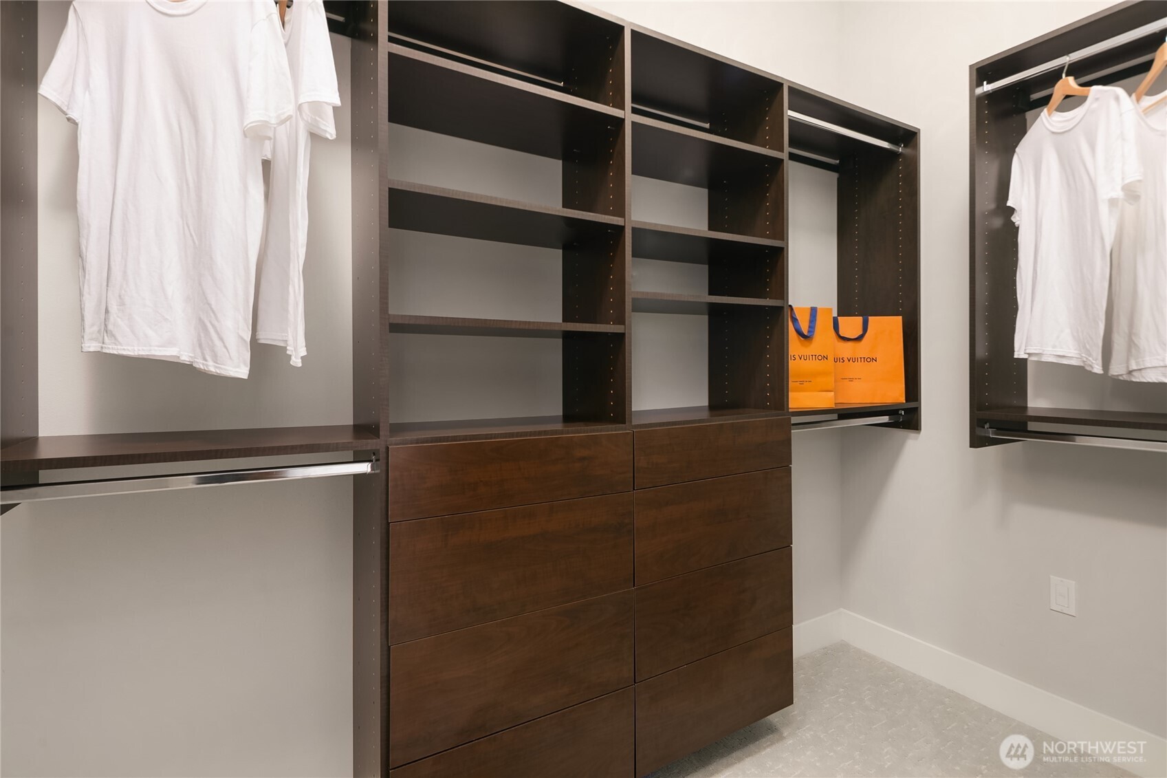 3501 Northwest 67th Street Seattle, WA 98117 - Photo 26 of 40 a view of walk in closet with clothes and shoes