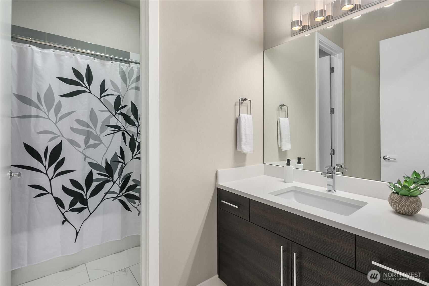 3501 Northwest 67th Street Seattle, WA 98117 - Photo 29 of 40 a bathroom with a sink and a mirror