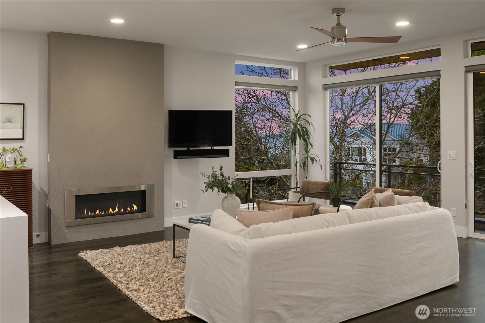 3501 Northwest 67th Street Seattle, WA 98117 - Photo 5 of 40 a living room with fireplace furniture and a flat screen tv