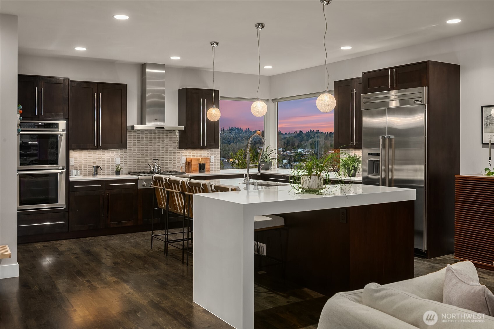 3501 Northwest 67th Street Seattle, WA 98117 - Photo 9 of 40 a kitchen with stainless steel appliances granite countertop a sink and a refrigerator